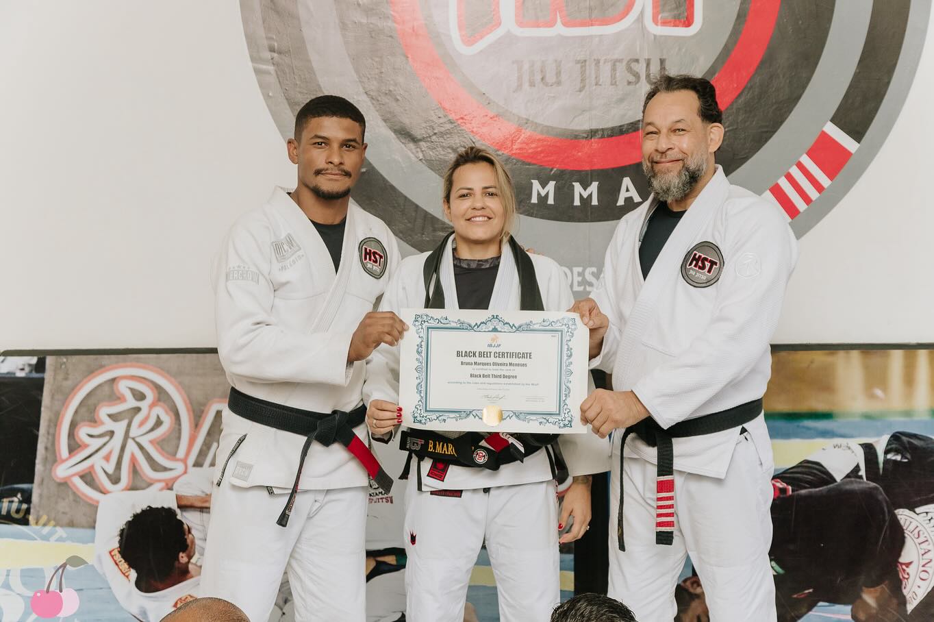 Bruna Marques wearing her third-degree black belt in Brazilian Jiu-Jitsu